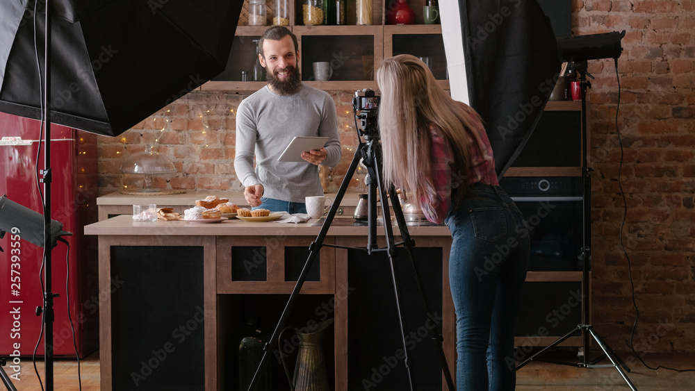 Online recipe. Man with tablet. Cooking hobby. Culinary podcast shooting. Backstage photography