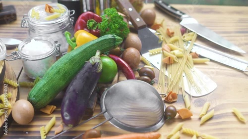 Food composition from fresh vegetable, eggs and macaroni on wooden background. Raw vegetable and ingredient for cooking pizza and pasta. Italian cuisine. Haelthy diet and nutrition. photo