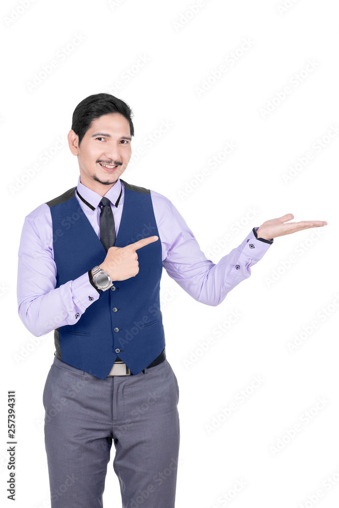Young asian businessman pointing his open palm Young asian businessman pointing his open palm