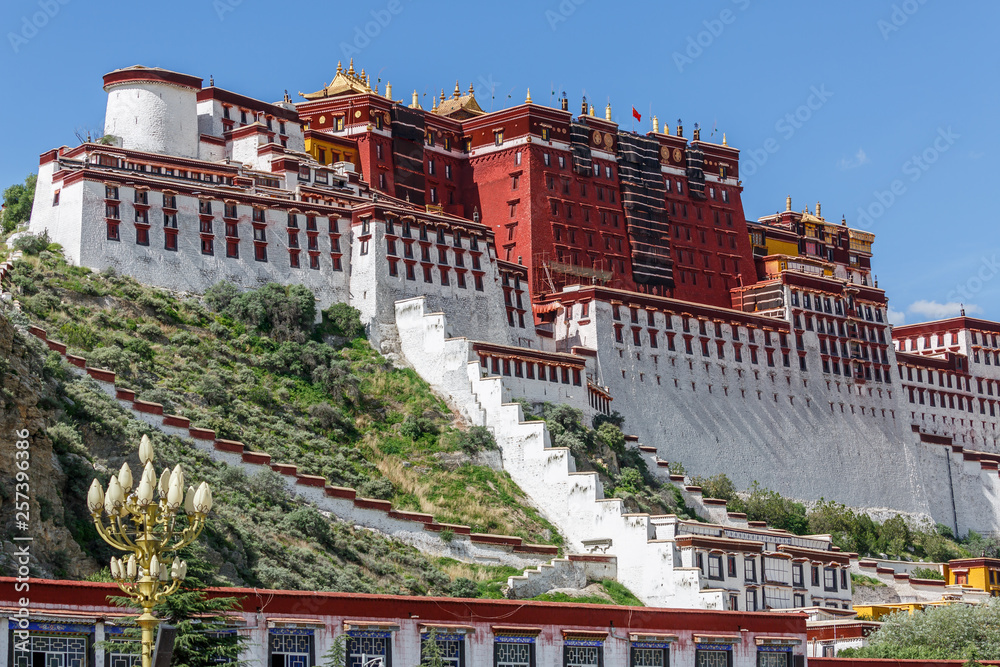 Fototapeta premium Side view on Potala Palace (Lhasa, Tibet, China. Nowadays, it is considered the most important architectural space of the Tibetan Buddhism,