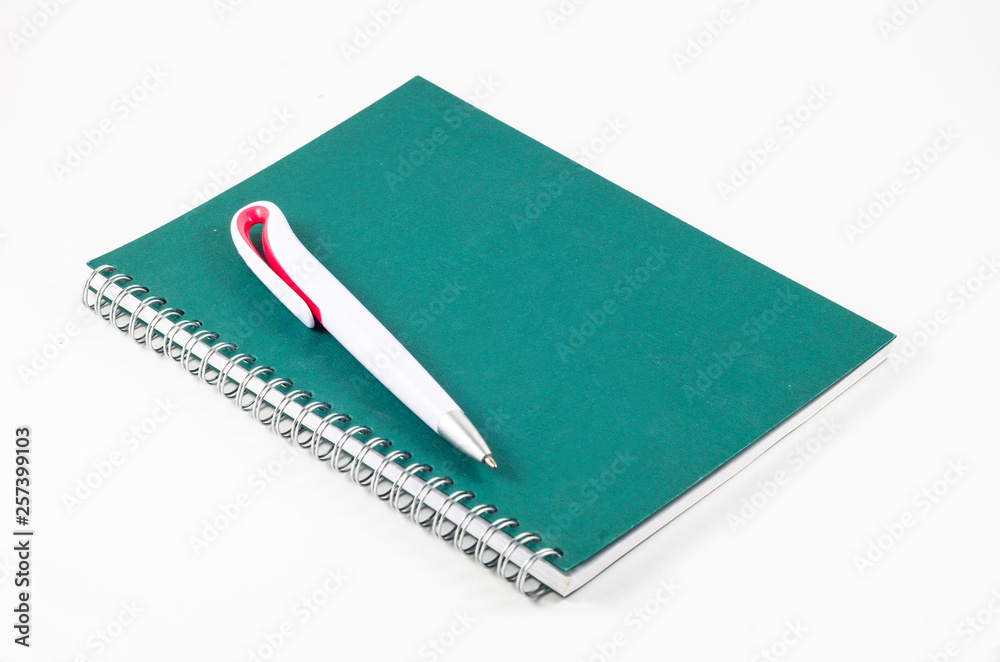 notebook with a pen on a white background notebook with a pen on a white background