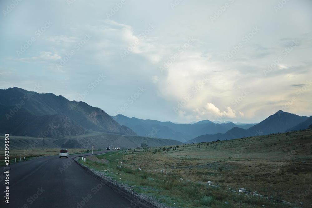 The road in the mountains from the car window. The road in the mountains from the car window.