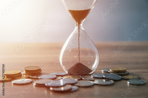hourglass with coins