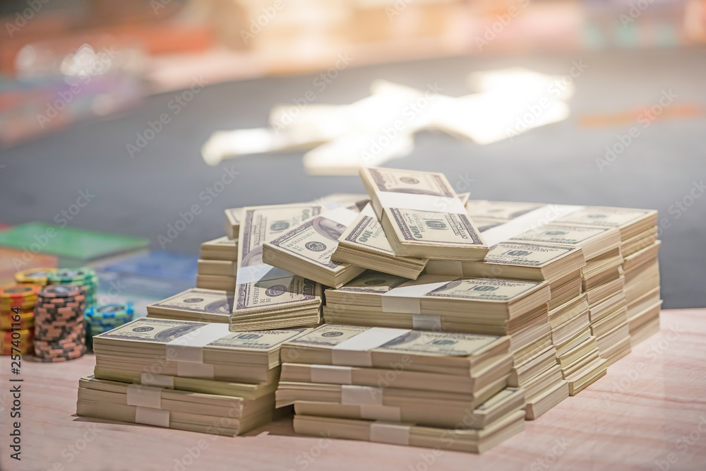 A total of hundreds of dollars.Betting is a bet for investors. The gambling concept. Businessmen are gambling in casinos.soft focus.