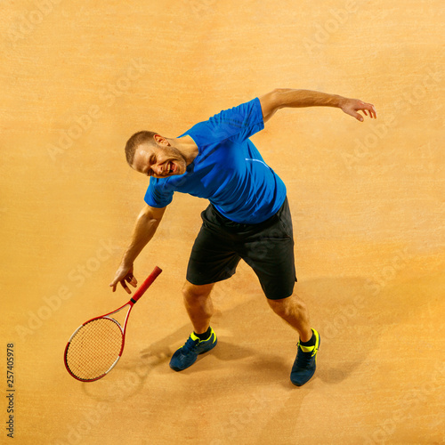 Stressed tennis player throwing and breaking a racket in anger and rage at court. Human emotions, defeat, crash, failure, loss concept. © master1305