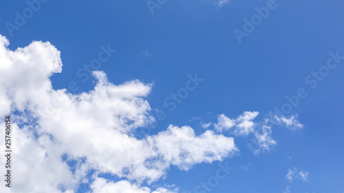 Blue sky background with white clouds  rain clouds on sunny summer or spring day.