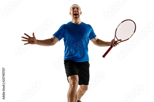 Portrait of a handsome male tennis player celebrating his success isolated on a white studio background. Human emotions, winner, sport, victory concept