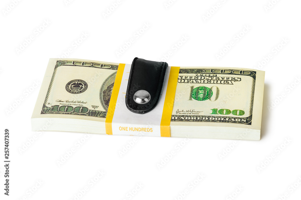 Money clip holding a bunch of dollars Money clip holding a bunch of dollars