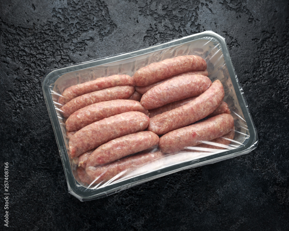 Freshly made raw butchers sausages in skins Freshly made raw butchers sausages in skins