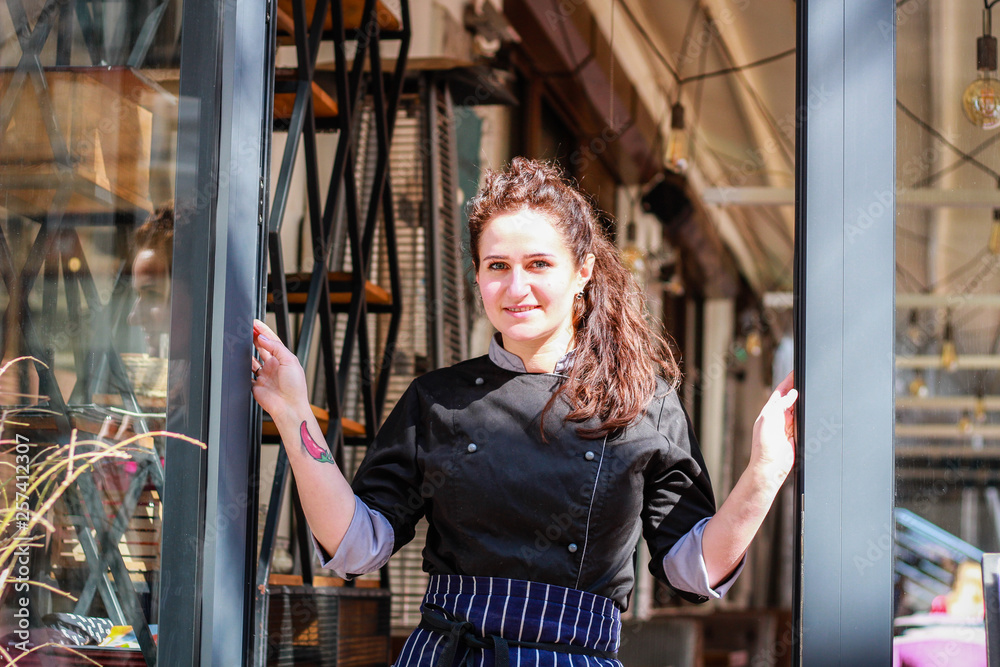 Portrait of Chef's Girl. In a kite on the street.Cooking.Crown food.Charismatic chef Portrait of Chef's Girl. In a kite on the street.Cooking.Crown food.Charismatic chef