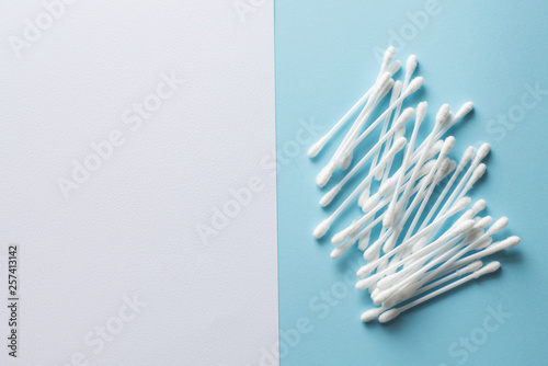 Cotton bud on blue background  plastic cotton swabs. copy space. place for text