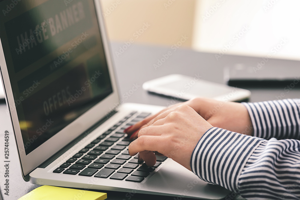 Female IT designer working in office, closeup Female IT designer working in office, closeup