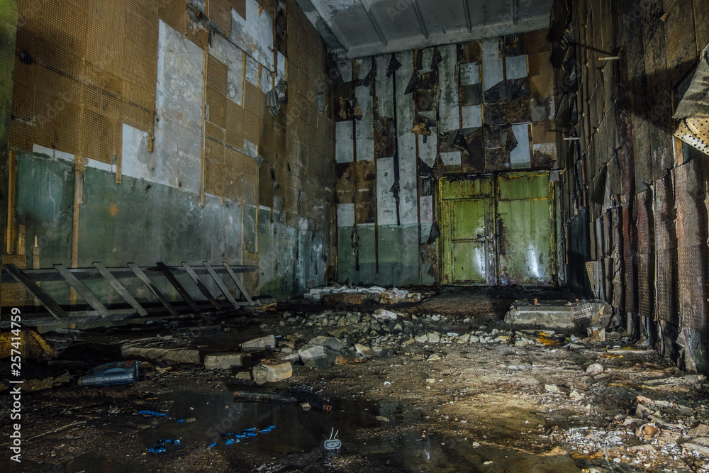 Inside abandoned machine hangar or warehouse waiting for demolition