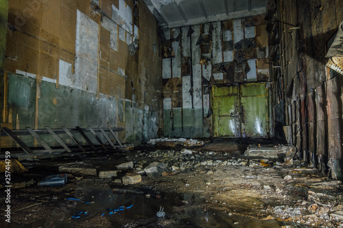 Inside abandoned machine hangar or warehouse waiting for demolition © Mulderphoto