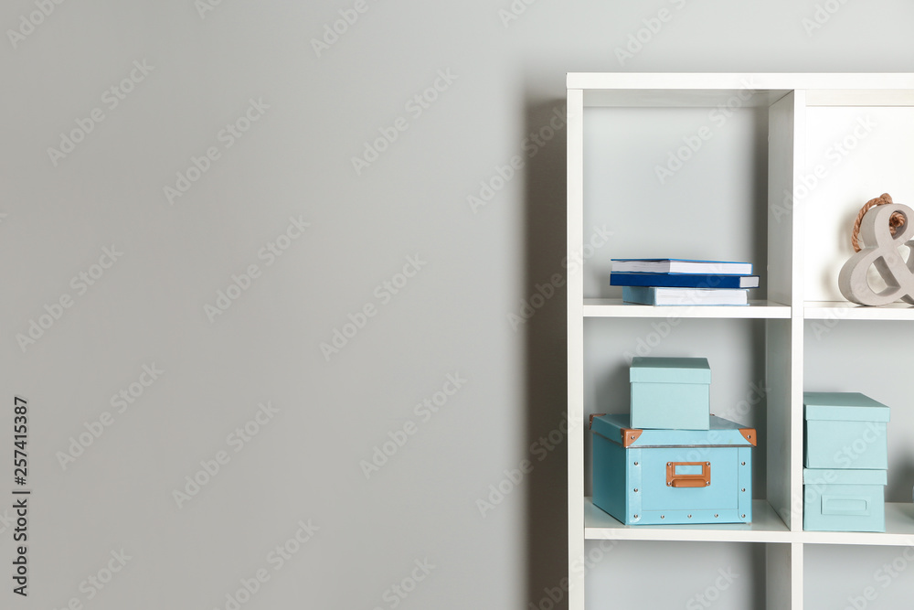 Modern shelf unit near white wall Modern shelf unit near white wall