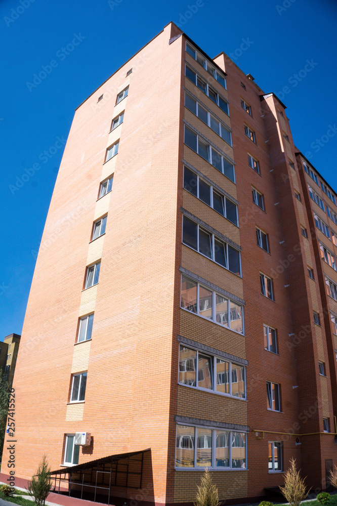 Modern and new apartment building. Multistoried, modern, new and stylish living block of flats. Real estate. New house. Newly built block of flats