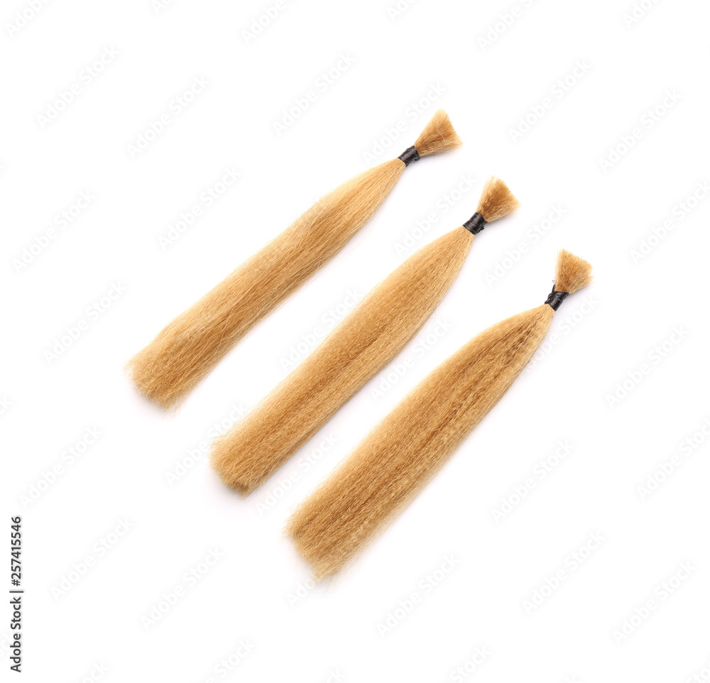 Hair strands on white background. Concept of donation Hair strands on white background. Concept of donation