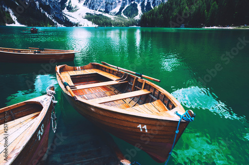 Traditional wooden boats on Braies Lake (Lago Di Braies). Dolomites, Italy, Europe.