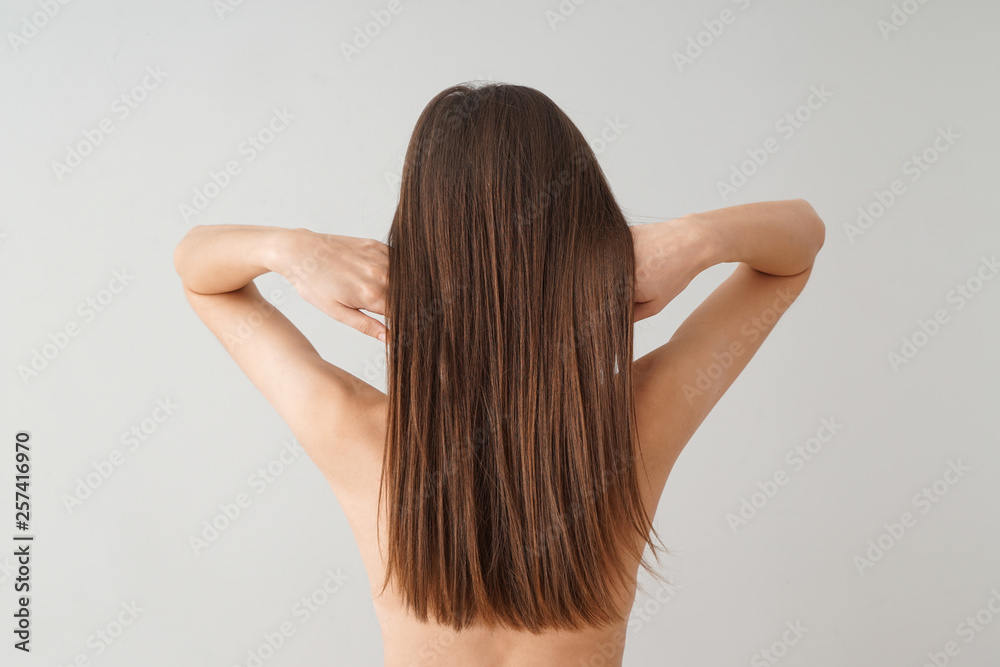 Young woman with beautiful long hair on white background Young woman with beautiful long hair on white background