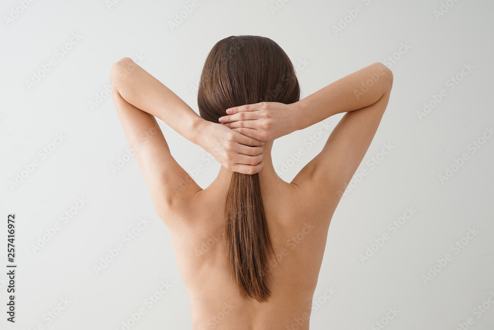 Young woman with beautiful long hair on white background Young woman with beautiful long hair on white background