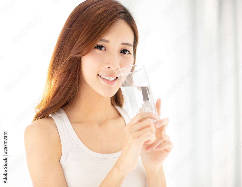 smiling beautiful young woman drinking water smiling beautiful young woman drinking water