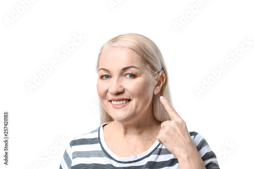 Mature woman with hearing a...