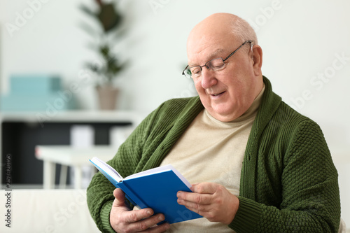 Senior man with hearing aid...