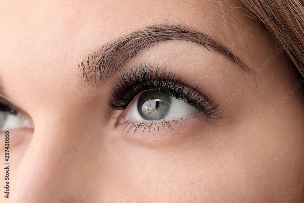 Young woman with beautiful eyelashes, closeup Young woman with beautiful eyelashes, closeup