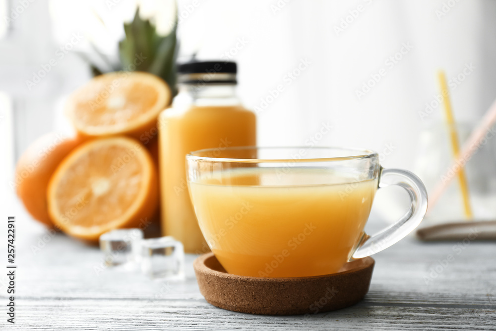 Glass cup of orange juice on table Glass cup of orange juice on table