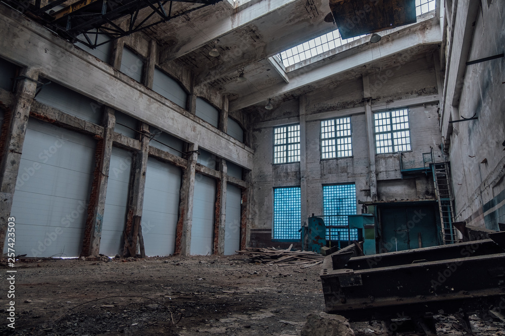 Abandoned factory interior. Empty industrial hall of workshop