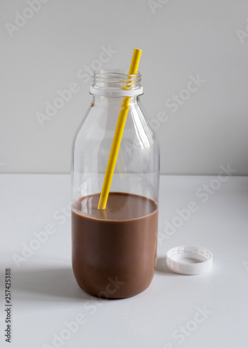 Lactose free chocolate oat milk in a plastic bottle.
