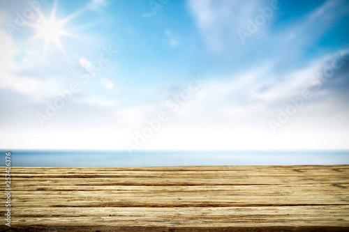 Desk of free space and summer sea landscape 