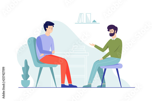 Sad man sitting on the chair talking to male psychologist
