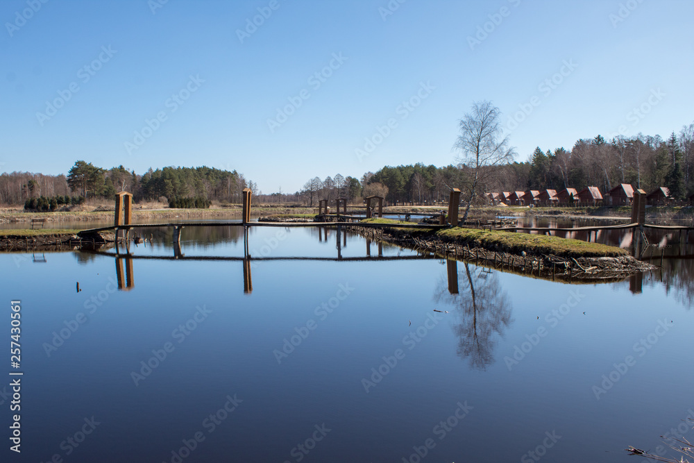 A beautiful place on the lake in a pine forest, a recreation center and slave fishing on the lake, a recreational place in Poland, Europe A beautiful place on the lake in a pine forest, a recreation center and slave fishing on the lake, a recreational place in Poland, Europe