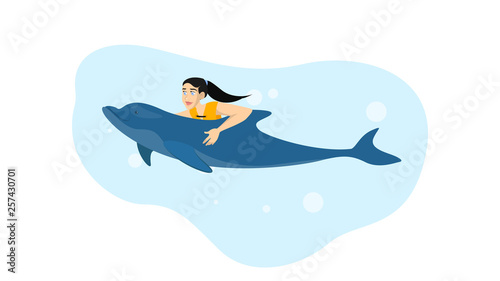 Woman swimming with a dolphin