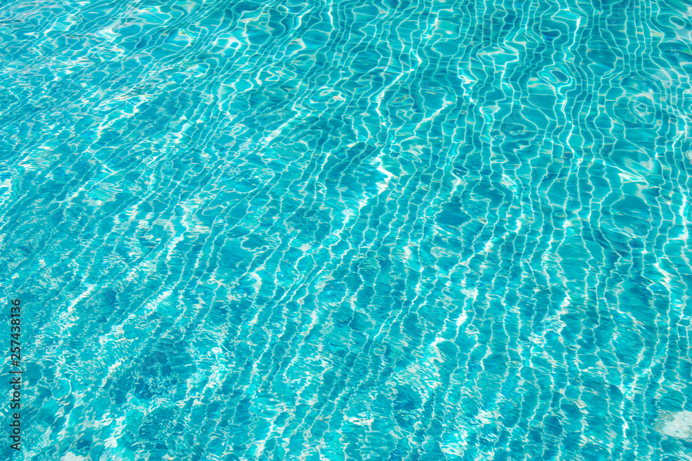 Waving blue water surface. blue clear fresh Water in jacuzzi.