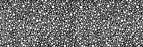 Wide-screen background with randomly scattered circles for a bold and catchy decision in style or a new trend. Seamless pattern if vertical.