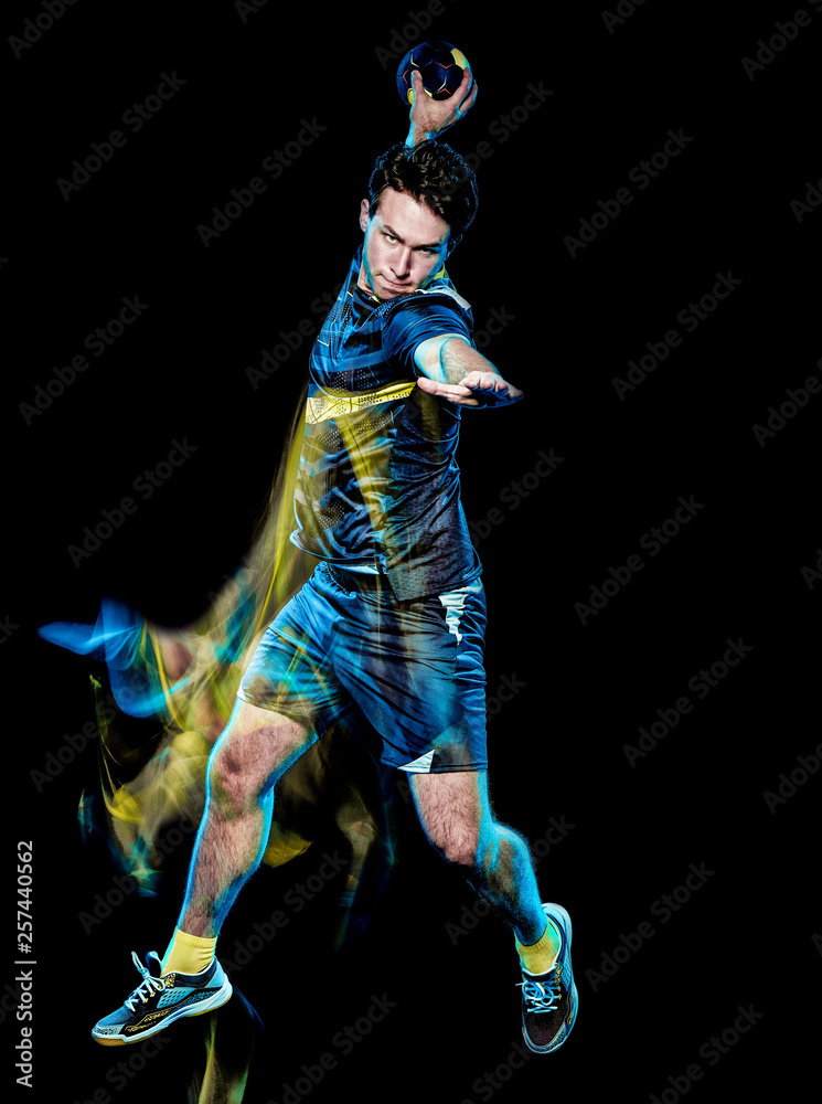one caucasian handball player young man isolated on black background with speed light painting effect motion blur one caucasian handball player young man isolated on black background with speed light painting effect motion blur