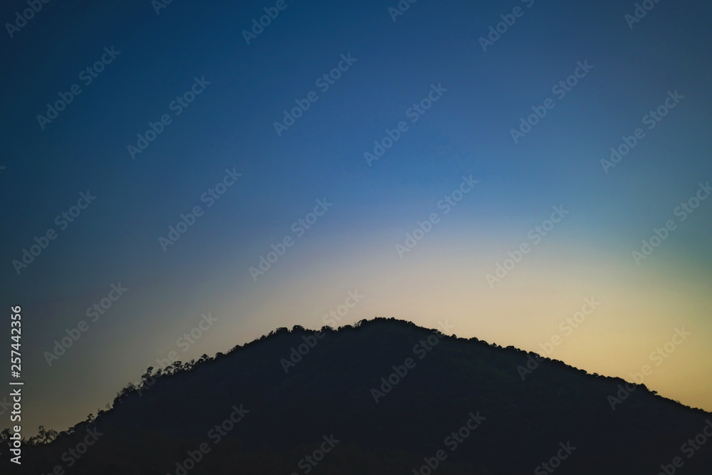 Background sky sunset,love travel to the beach orange tone,Bright in Phuket Thailand,Blue light moment. Background sky sunset,love travel to the beach orange tone,Bright in Phuket Thailand,Blue light moment.