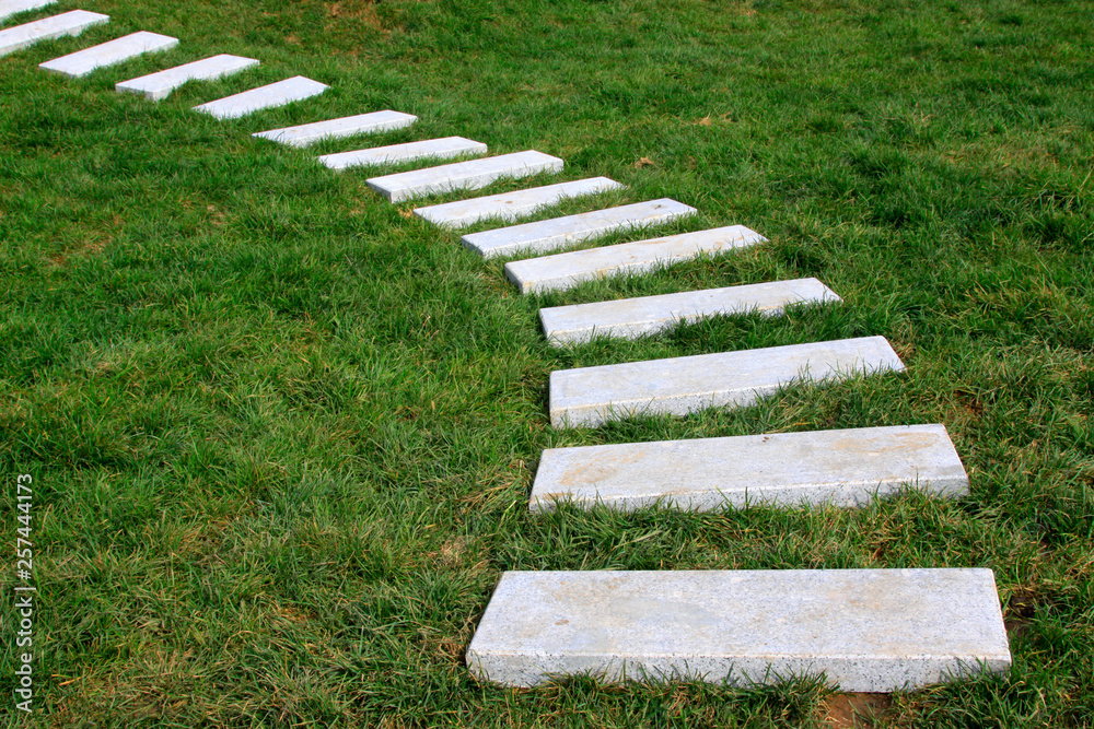 stone path in a park stone path in a park