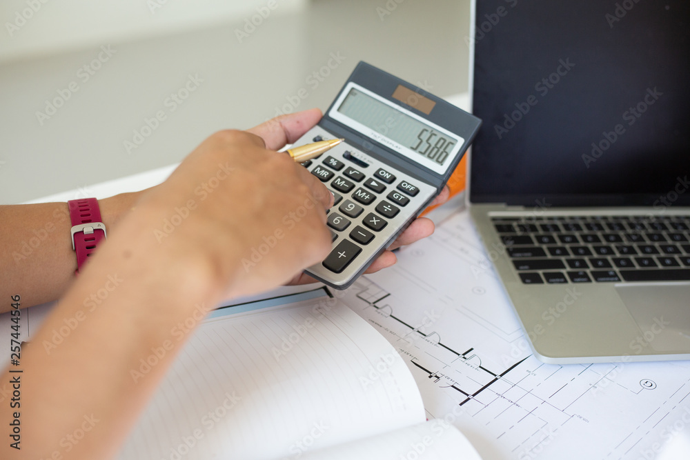 Businessmen are calculating budgets to invest in residential projects for customers.s.concept Businessmen are calculating budgets to invest in residential projects for customers.s.concept