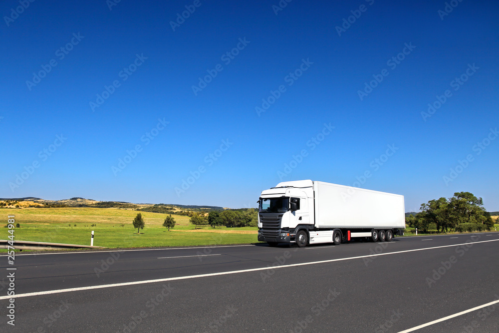 White truck transport on the road and cargo White truck transport on the road and cargo