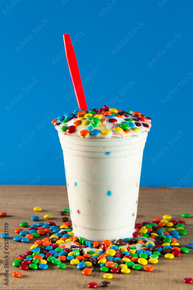 Naklejka premium Ice cream blizzard M&Ms refreshing cool relaxing taste good ice cream blizzard
