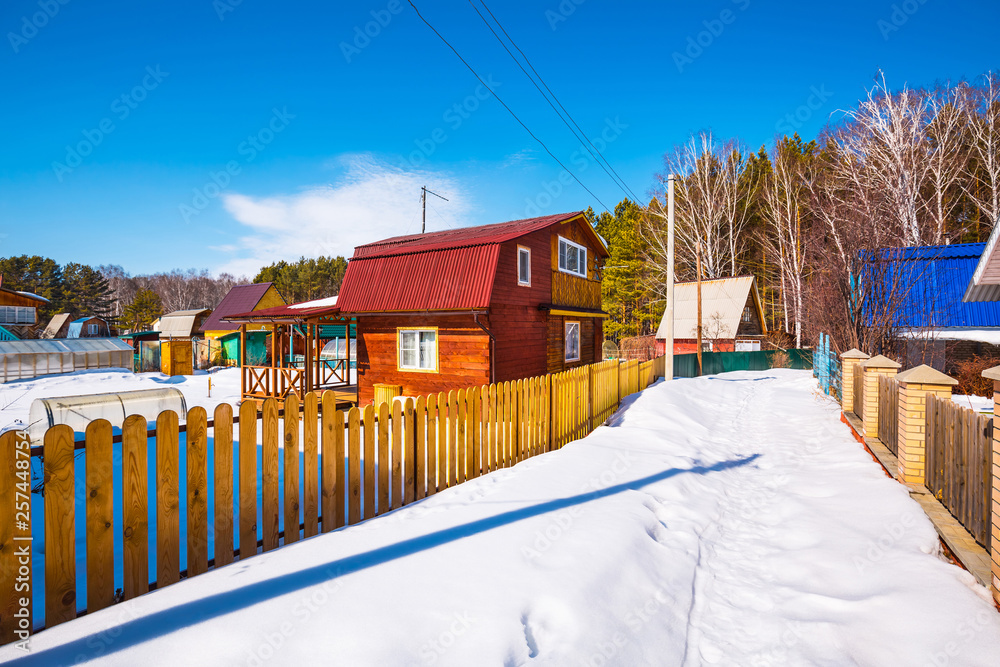 Naklejka premium Country house in winter. Western Siberia