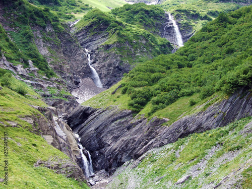 Waterfalls on the Mitteleggbach stream in the Wichlen Alpine Valley - Canton of Glarus, Switzerland photo