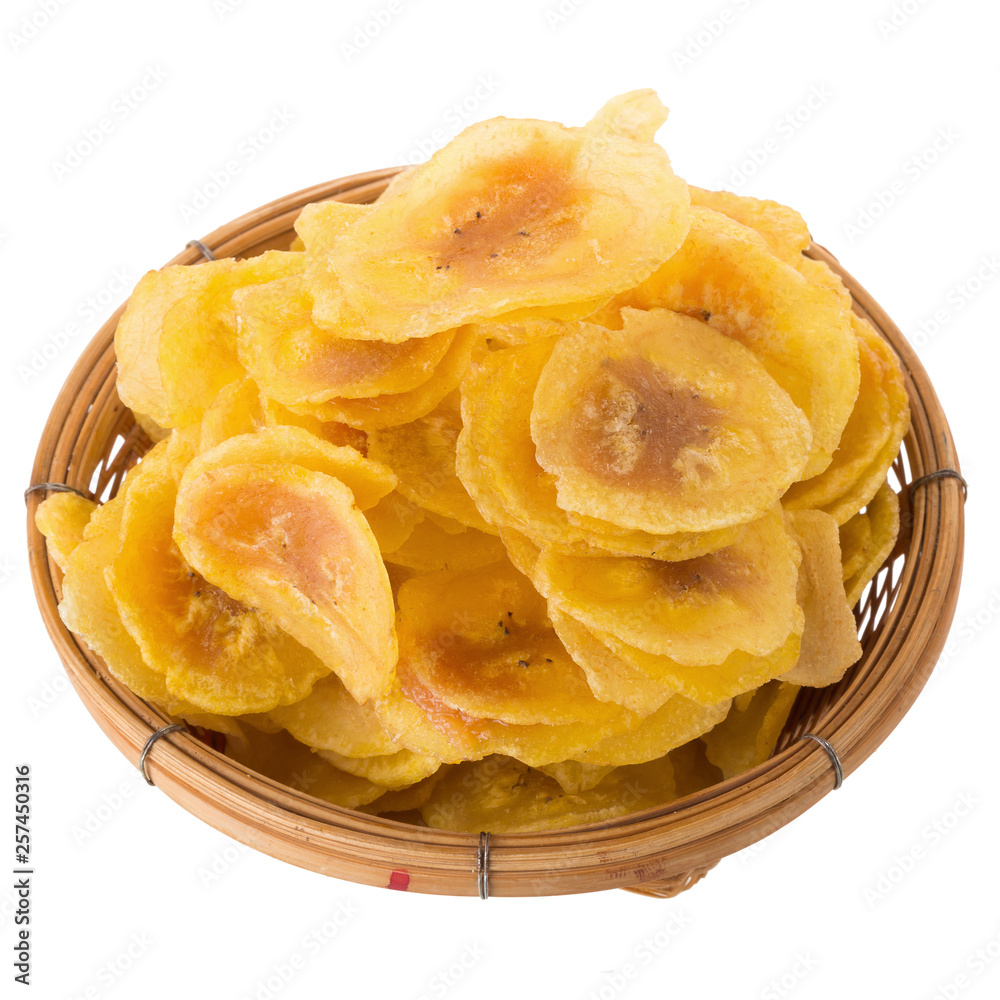 Dried banana chips in wooden bowl. Yellow deep fried slices of bananas Isolated on white background Dried banana chips in wooden bowl. Yellow deep fried slices of bananas Isolated on white background