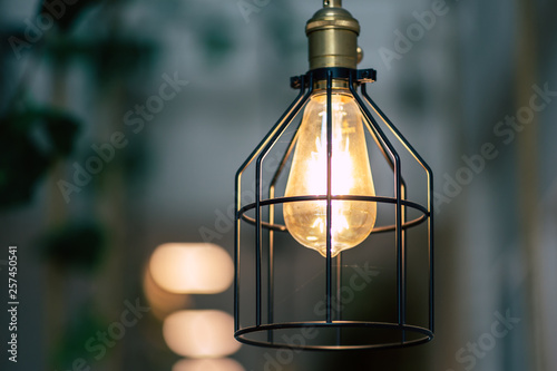 Beautiful retro luxury light lamp , Warm light coming in coffee cafe © NARANAT STUDIO