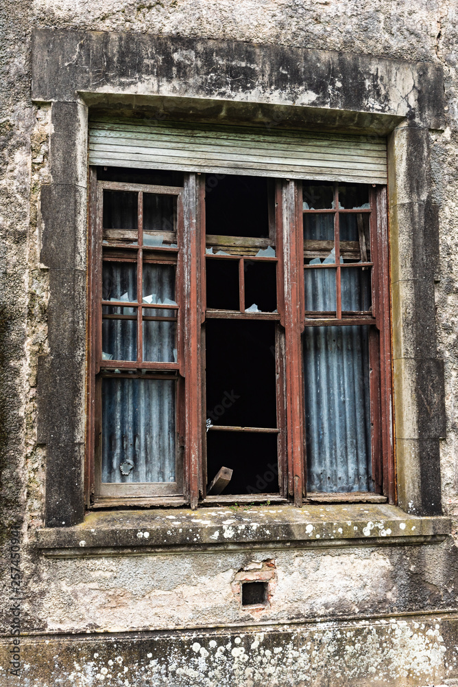 Window of an old abandoned house that caught fire