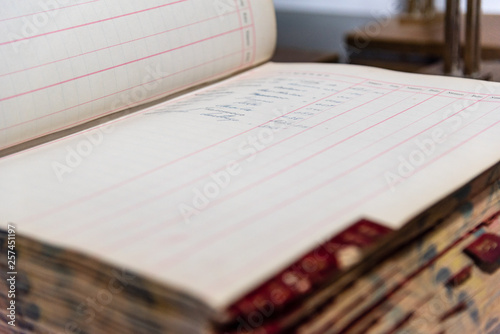 Antique handwritten accounting book of an old and inexistent business photo