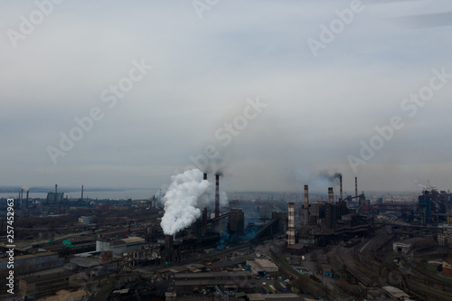 Polluting plant shot from above with a drone